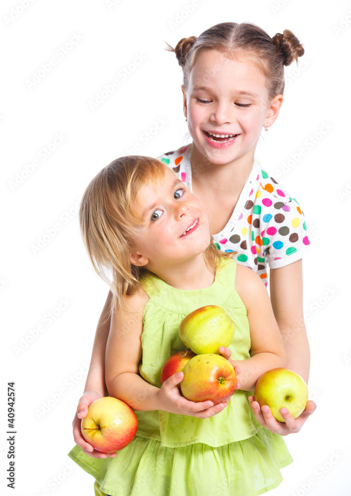 Portrait of two happy girls with apple Portrait of two happy girls with apple