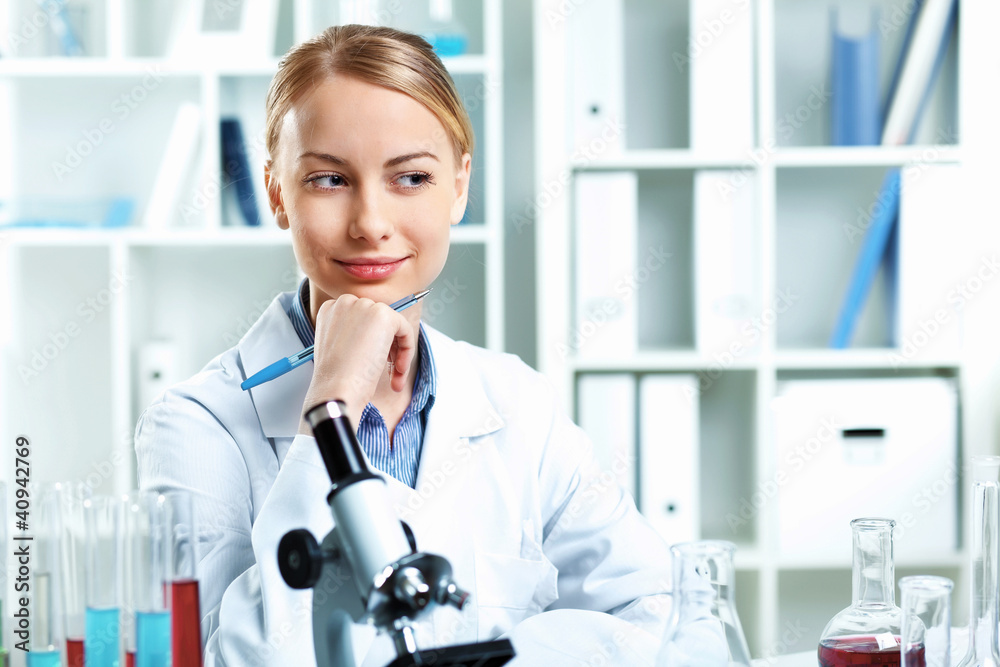 Young scientist working in laboratory Young scientist working in laboratory