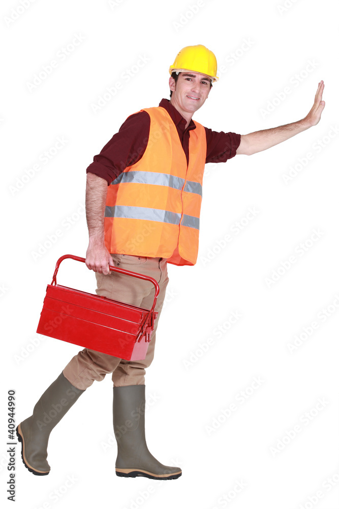 Tradesman pushing an invisible wall Tradesman pushing an invisible wall