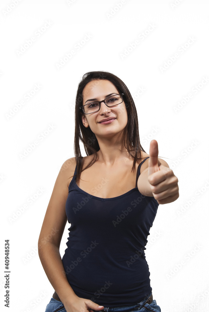 A young, successful woman holds his thumb up. Symbol for success A young, successful woman holds his thumb up. Symbol for success