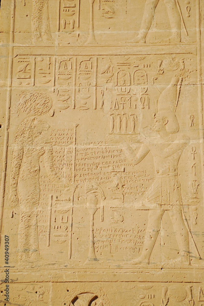 Egyptian hieroglyphs engraved on stone in Horus temple, Egypt