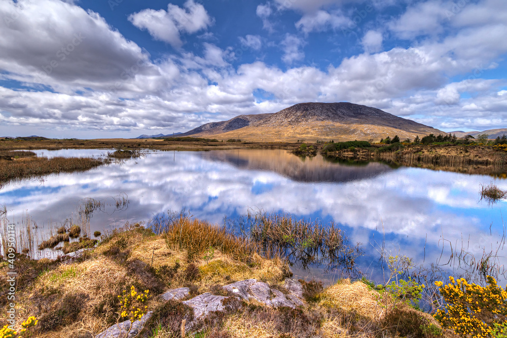 Connemara scenery of mountains reflected in lake, Ireland