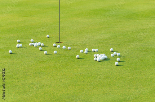 group of practice golf ball on green