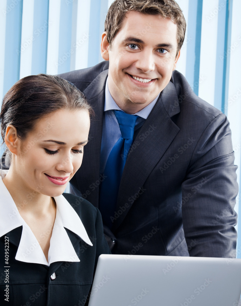 Businesspeople working with laptop at office Businesspeople working with laptop at office