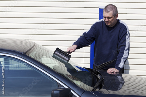Man washing car windows