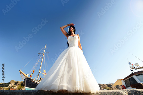 A bride in a Santorini port