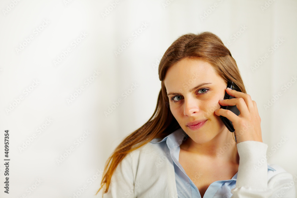 Beautiful businesswoman talking on the mobile phone Beautiful businesswoman talking on the mobile phone