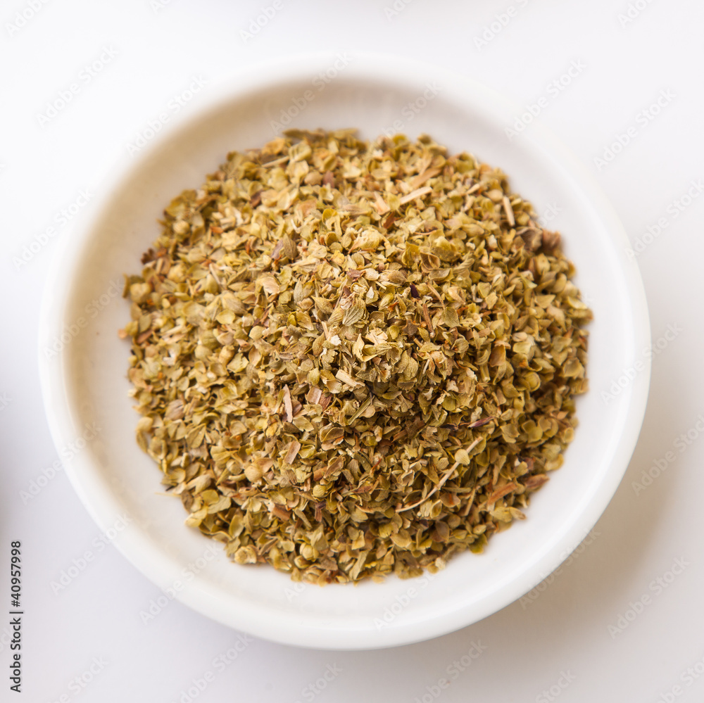 Colorful spices in white pods isolated on white