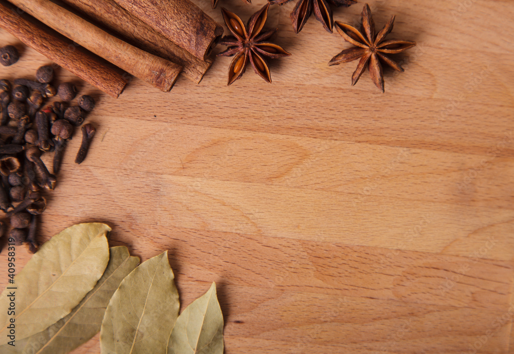 Frame composition of spices on wood,anise,cinnamon,laurel Frame composition of spices on wood,anise,cinnamon,laurel