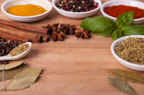 Frame composition of spices on wood anise cinnamon laurel
