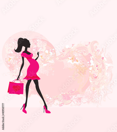 Beautiful pregnant woman on shopping