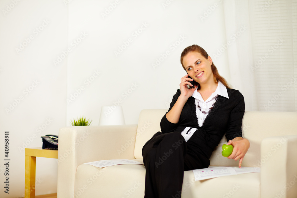 Friendly young business woman working on sofa Friendly young business woman working on sofa