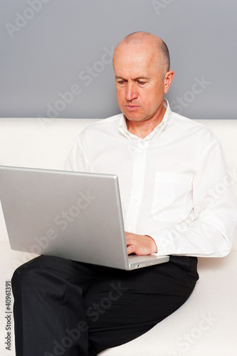 senior businessman with laptop