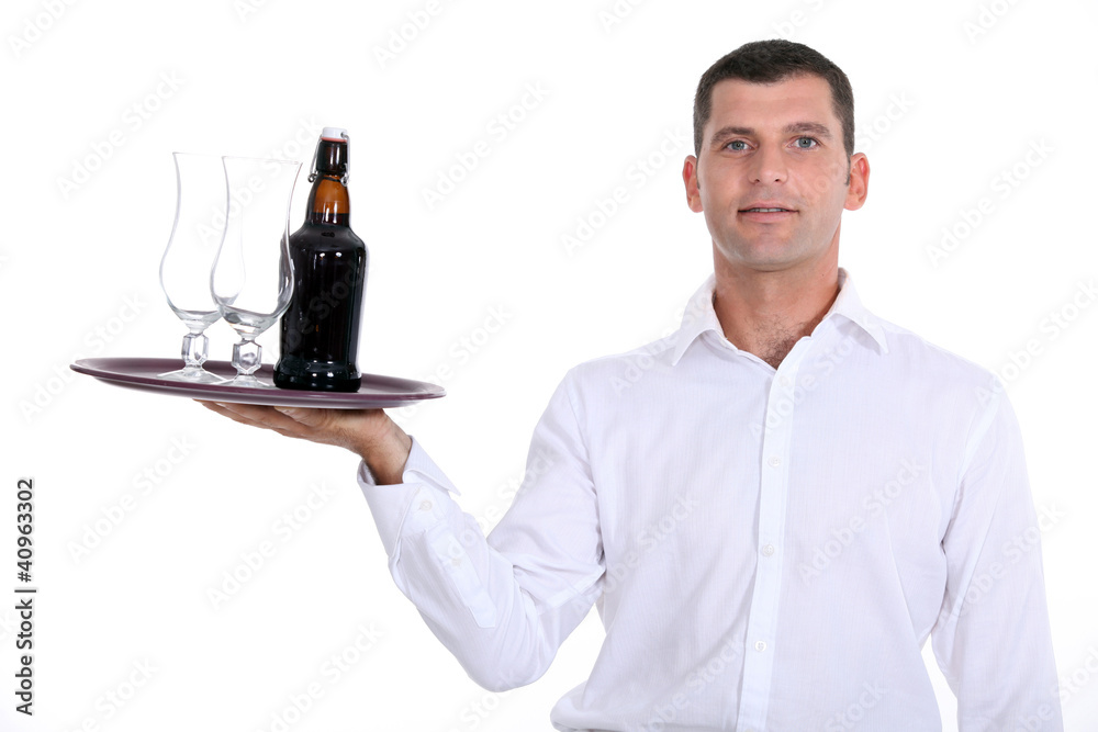 Waiter serving a bottle of beer