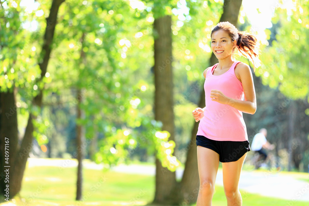 Runner - woman running in park Runner - woman running in park