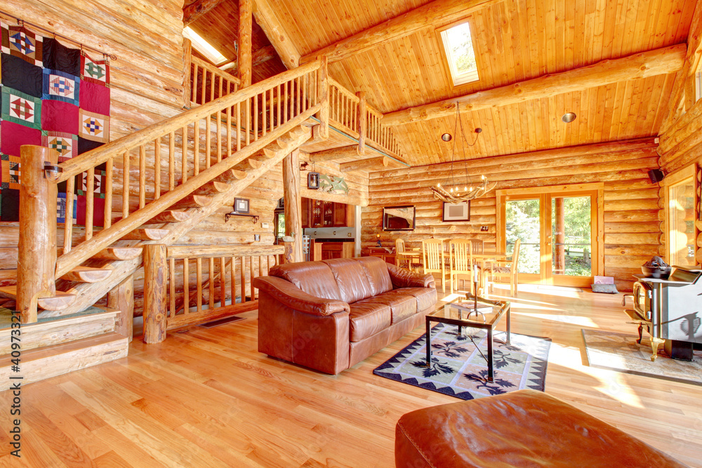 Luxury log cabin living room with leather sofa. Stock Photo | Adobe Stock