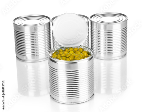 Open tin can of peas and closed cans isolated on white