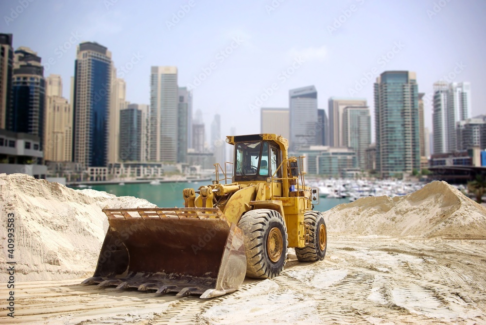 Naklejka premium Construction tractor in Dubai, United Arab Emirates .