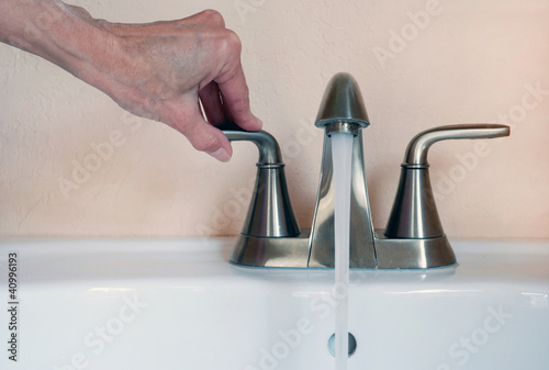 turning on faucet