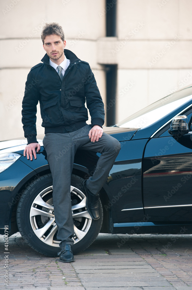 Young elegant man portrait with luxury car. Young elegant man portrait with luxury car.