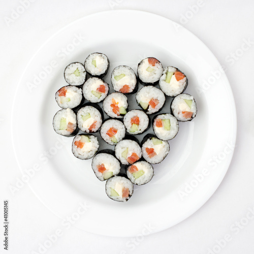 Sushi on a plate in the shape of heart