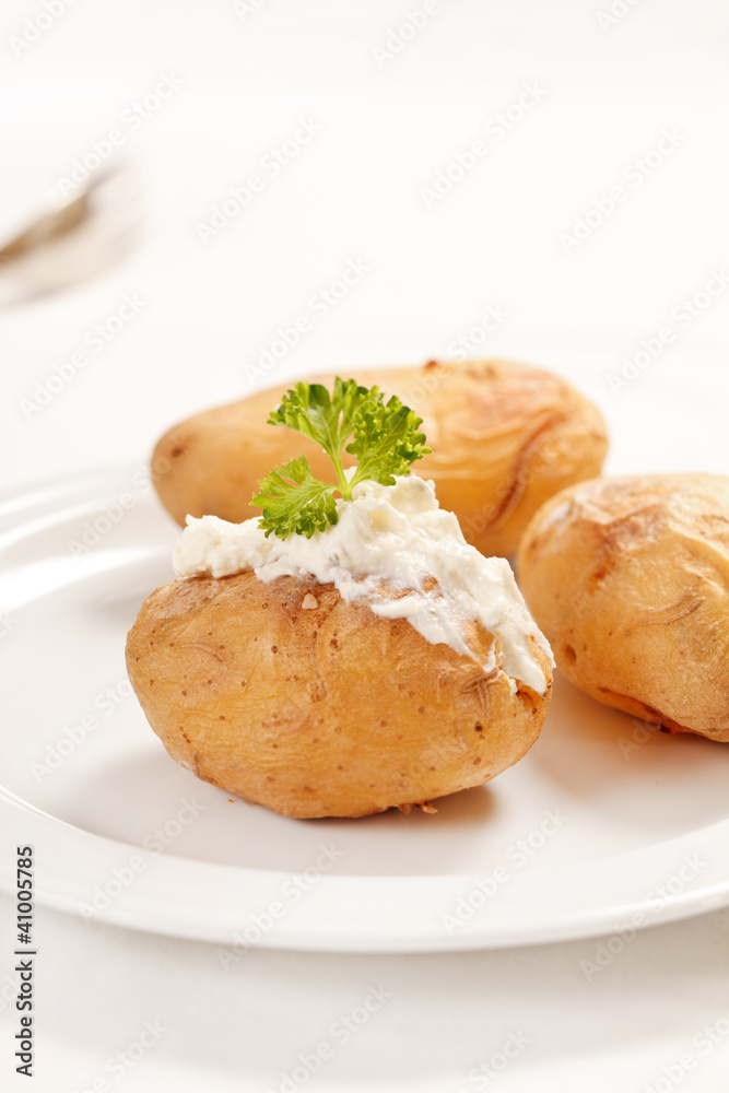 Baked potato filled with soft cheese