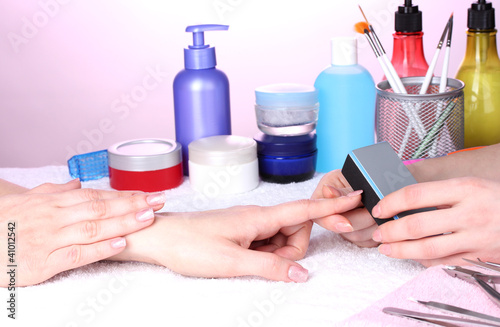 Manicure process in beautiful salon