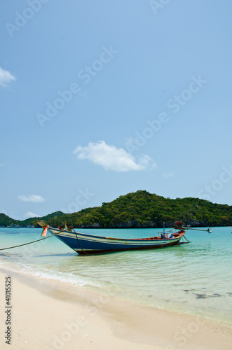 long tail boat on the beach © Chatchai