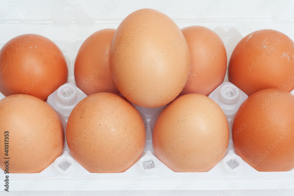 Fresh brown country eggs packaged in a dozen carton Fresh brown country eggs packaged in a dozen carton
