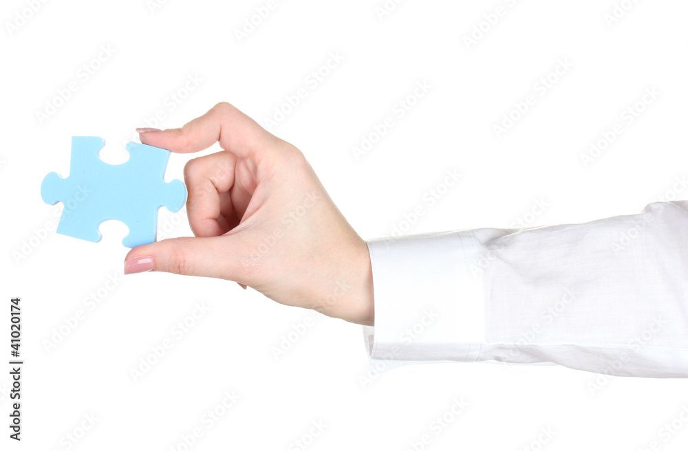 Fototapeta premium woman hand holding puzzle isolated on white