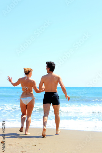 beautiful couple posing on the sea coast