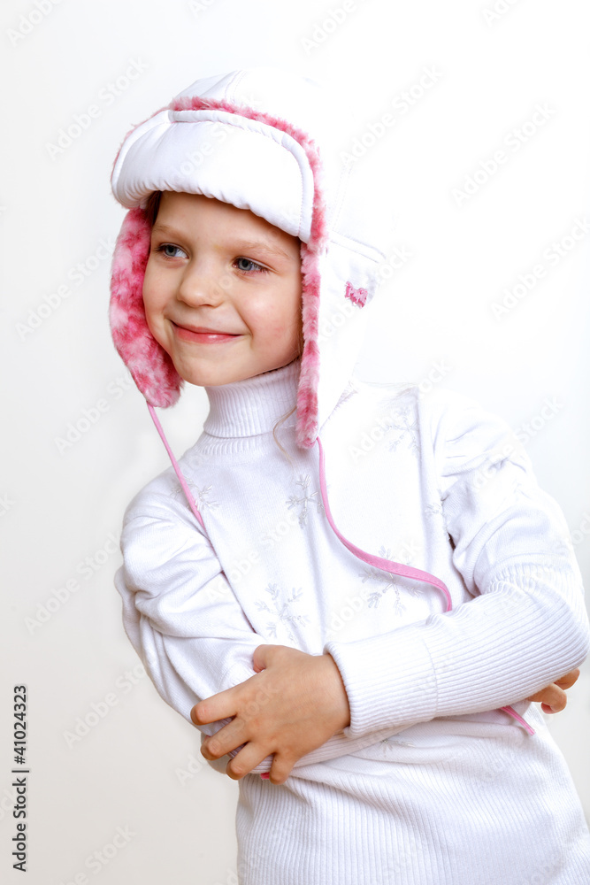 Kid in winter wear against white background Kid in winter wear against white background