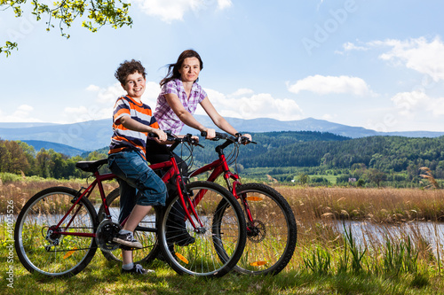 Mother and son riding bikes
