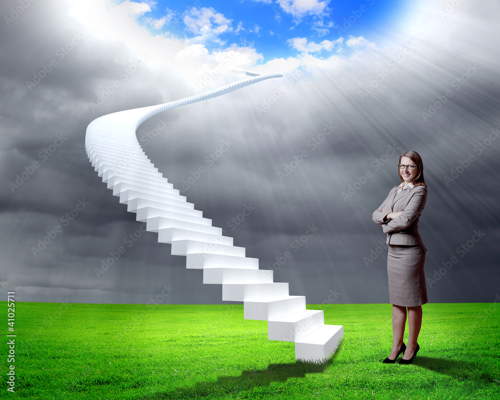 Businesswoman in suit standing near stairs Businesswoman in suit standing near stairs