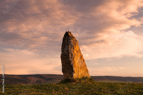 Menhir on the hill at sunset in Morinka in Czech Republic photo