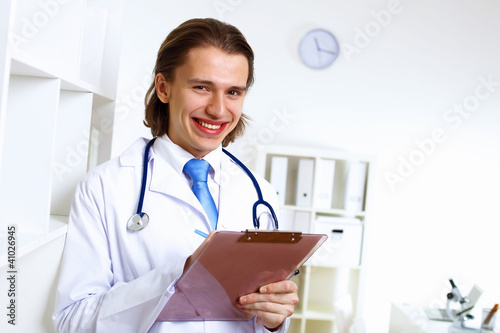 Friendly doctor in medical office