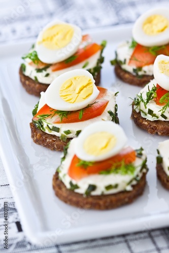 Appetisers with quail eggs and soft cheese