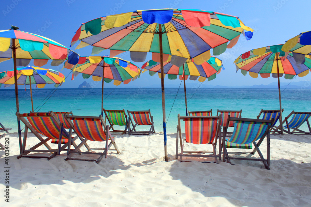 Beach chair and colorful umbrella on the beach , Phuket Thailand