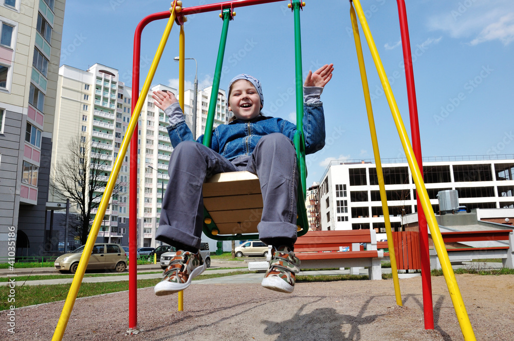 Fototapeta premium A boy on a swing