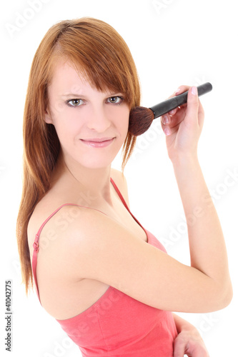 Happy teenager with make-up brush