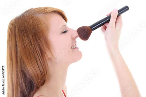 Happy teenager with make-up brush