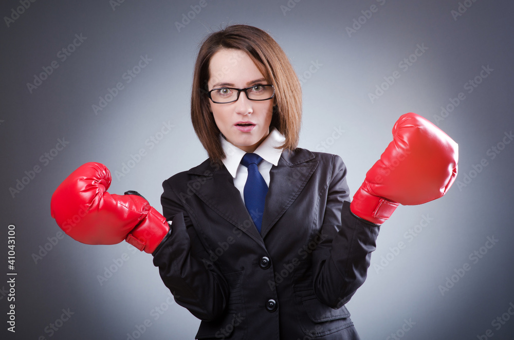 Young businesswoman in boxing concept Young businesswoman in boxing concept