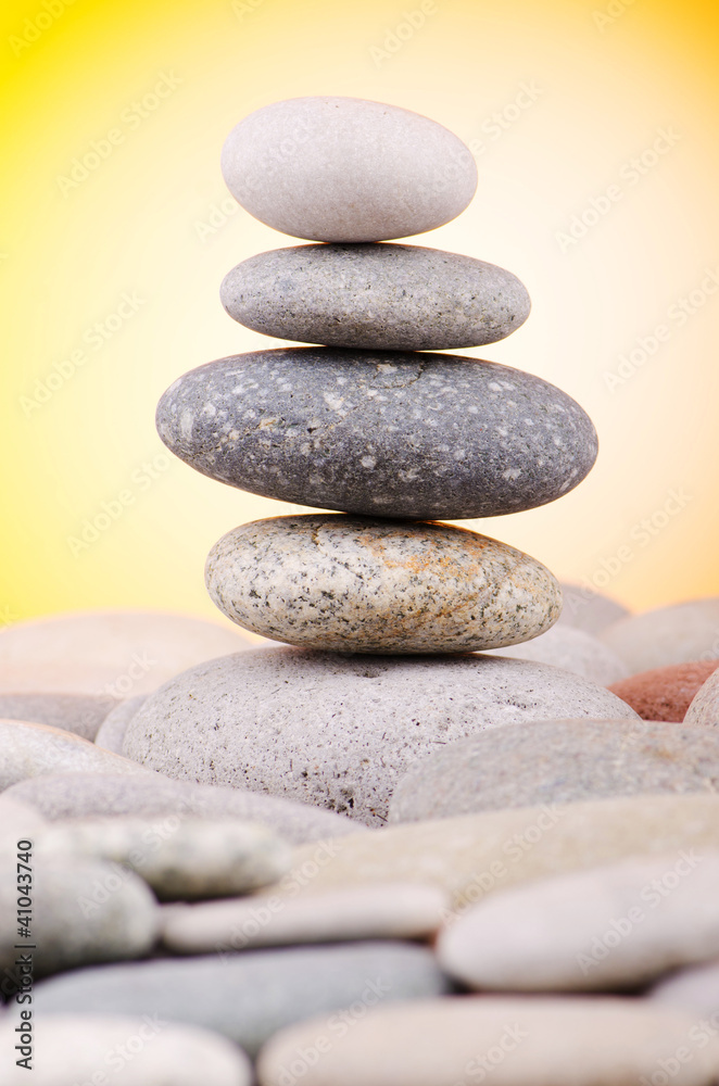 Pebbles stack against gradient background Pebbles stack against gradient background