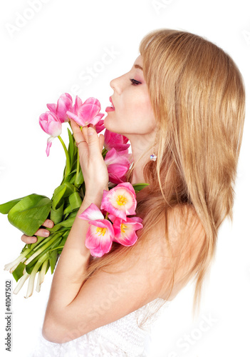 Picture of happy young blonde woman with colorful flowers