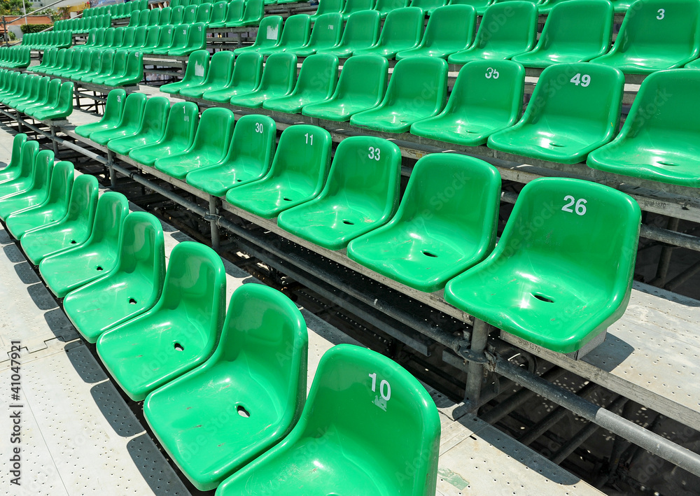 Fototapeta premium plastic green old chairs in stadium