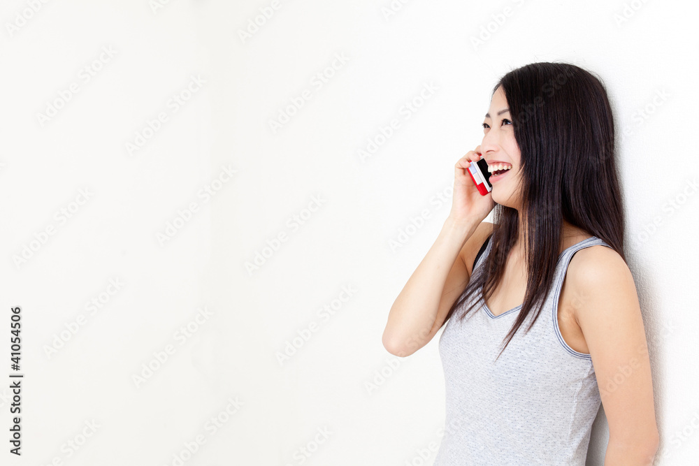 attractive asian woman talking by cellphone attractive asian woman talking by cellphone