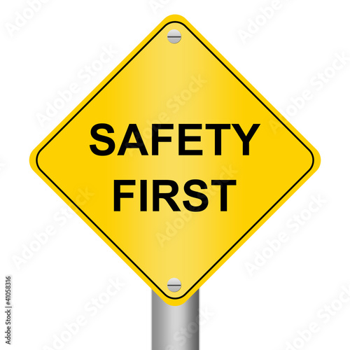 The Safety First Road Sign Isolated on White Background