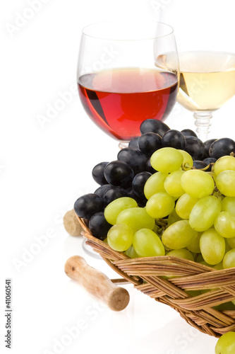 wine in glass and grape isolated on white