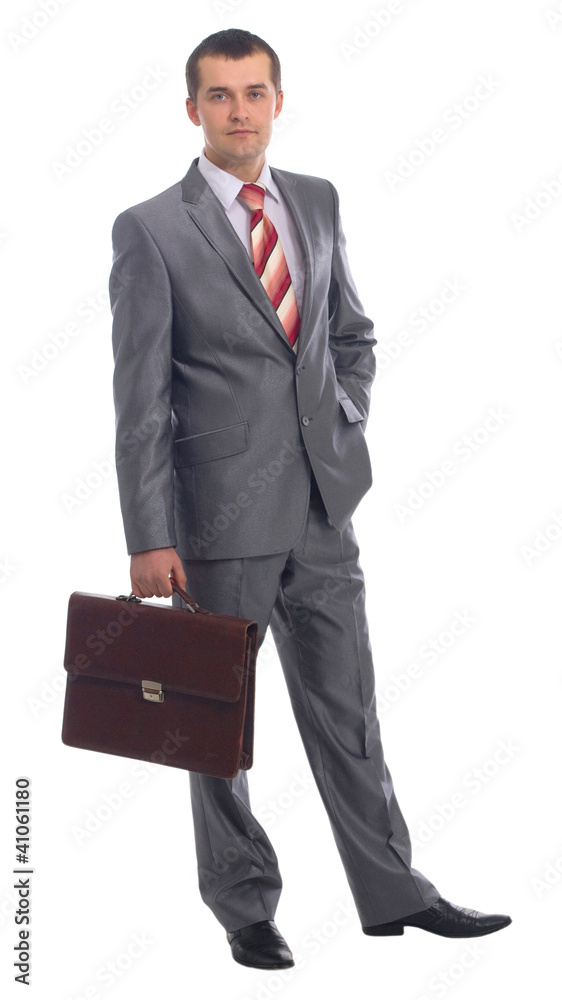 Portrait of a happy young business man holding suitcase Portrait of a happy young business man holding suitcase
