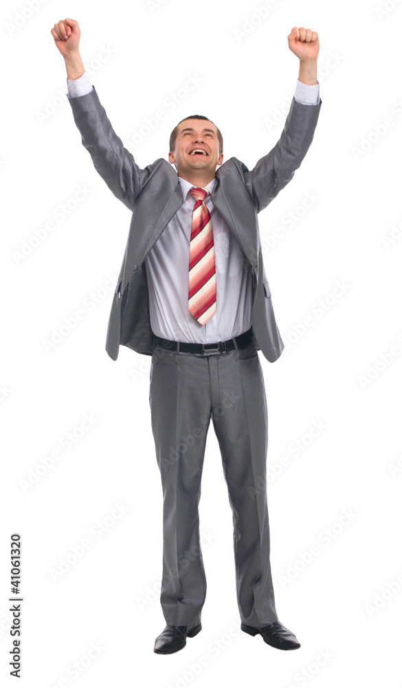 Excited handsome business man with arms raised in success Excited handsome business man with arms raised in success
